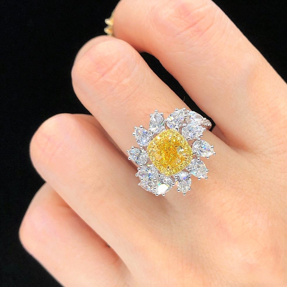 Luxury diamond engagement ring with yellow center stone by Eze Jewelry