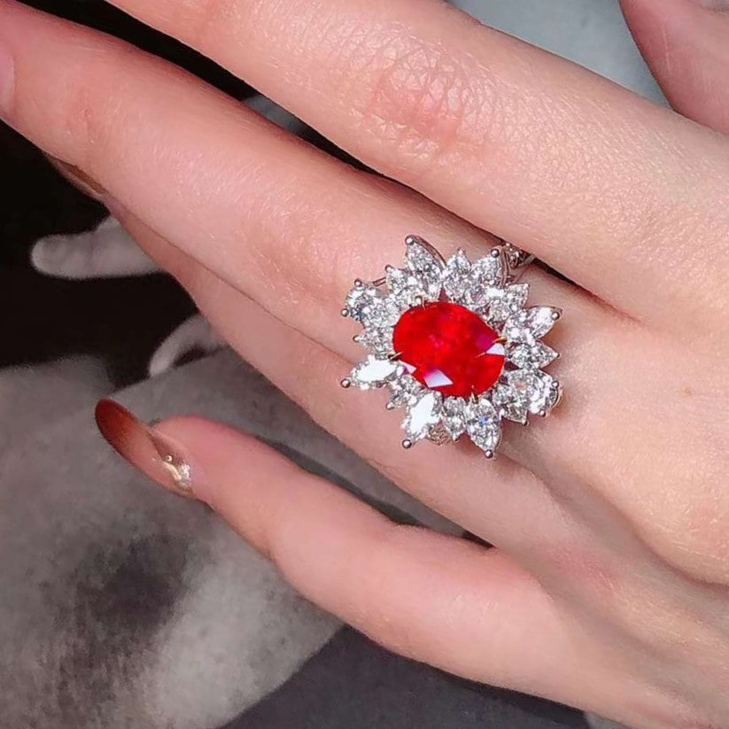 Oval Ruby Ring with Diamond Halo in 18K White Gold