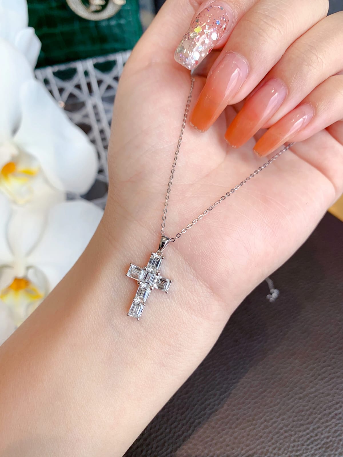 Close-up of 6 GIA Certified Diamonds in 18k White Gold Cross Necklace