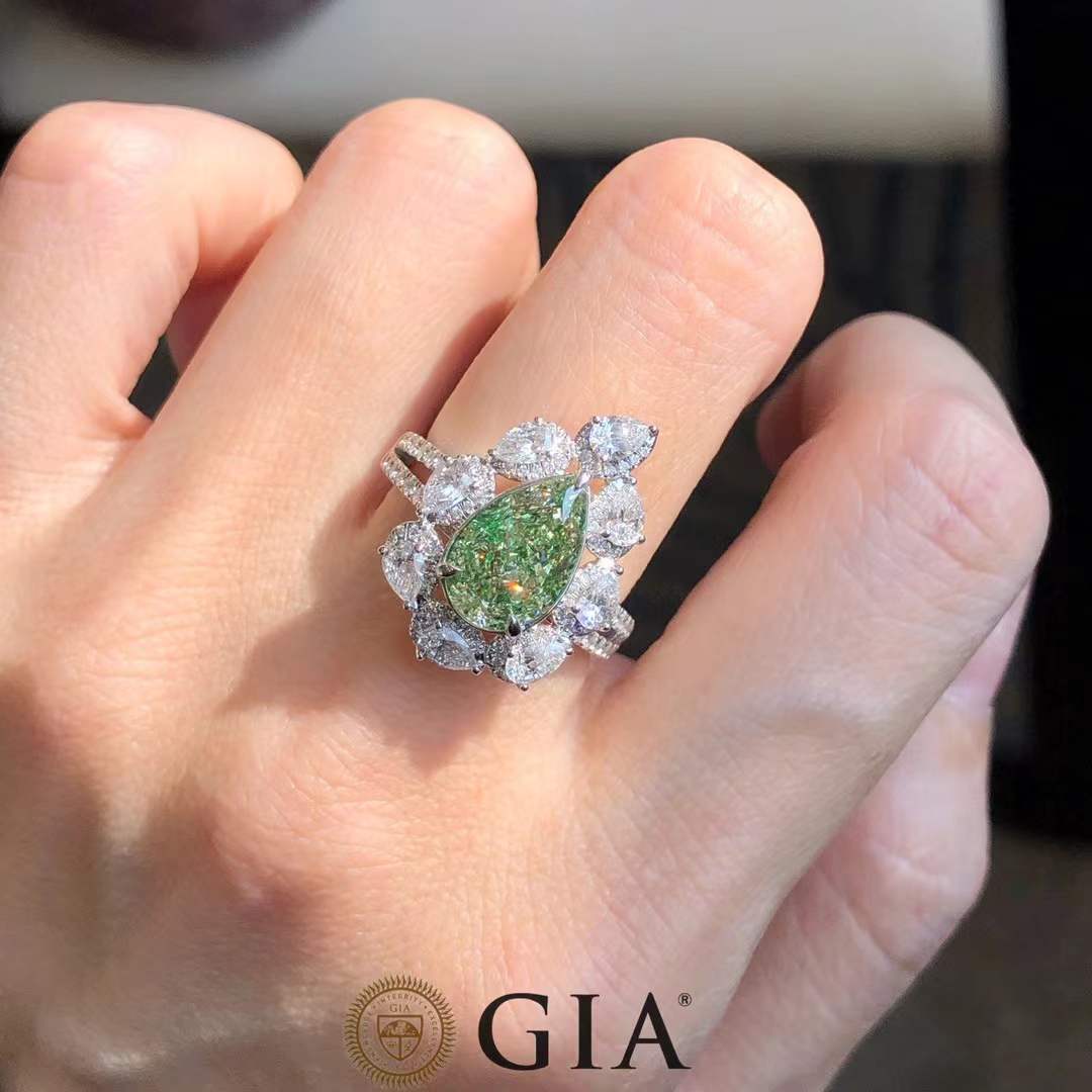 Pear cut green diamond ring with white halo in 18k white gold, 2.52ct center stone