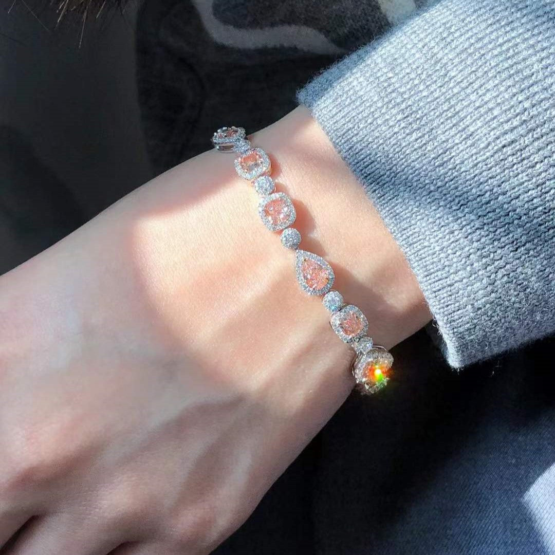 Side view of the 18k white gold bracelet, showcasing its sleek design and the harmonious blend of pink diamonds and white diamonds