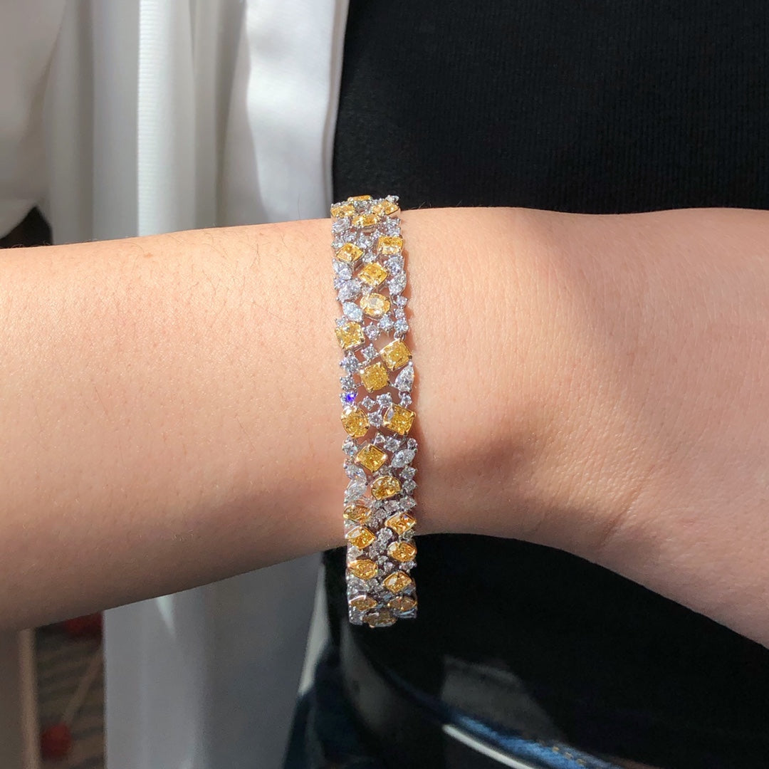 “15 carat diamond bracelet with yellow and white diamonds in 18k gold”