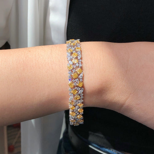 “15 carat diamond bracelet with yellow and white diamonds in 18k gold”