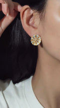 Elegant 18K gold brushed flower stud earrings featuring 1.44 carats of natural diamonds.