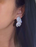 Exquisite butterfly-shaped 18K gold stud earrings fully set with 4.60 carats of natural diamonds.