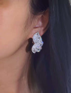 Exquisite butterfly-shaped 18K gold stud earrings fully set with 4.60 carats of natural diamonds.