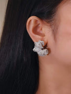 Side view of cloud-shaped stud earrings in 18K solid gold, featuring 6.30 carats of natural diamonds.