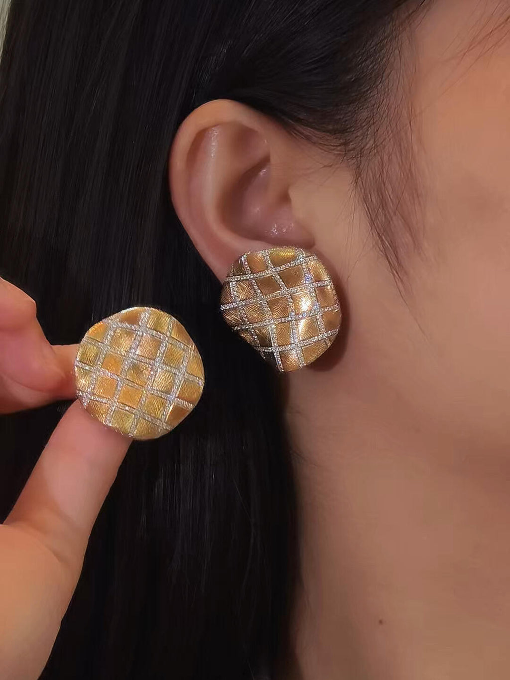  18K yellow gold tennis stud earrings with 2.11 carats of natural diamonds, weighing 10.6 grams.