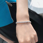 Bracelet tennis halo de diamants taille émeraude