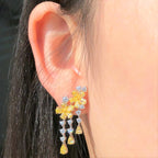 “4.30ct fancy yellow diamond dangle earrings in 18k white and yellow gold”