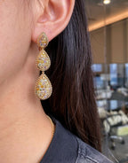  4.63-carat natural fancy-colored diamond tiered drop earrings with cascading teardrop gold frames