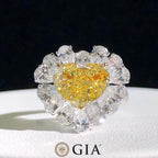  Close-up of 3.02ct heart-shaped yellow diamond with white diamond halo in 18K white gold.