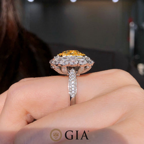 Close-up of 4.52ct Fancy Light Yellow Diamond and 3.55ct white diamonds in 18k white gold engagement ring