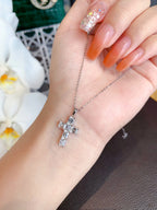 Close-up of 6 GIA Certified Diamonds in 18k White Gold Cross Necklace