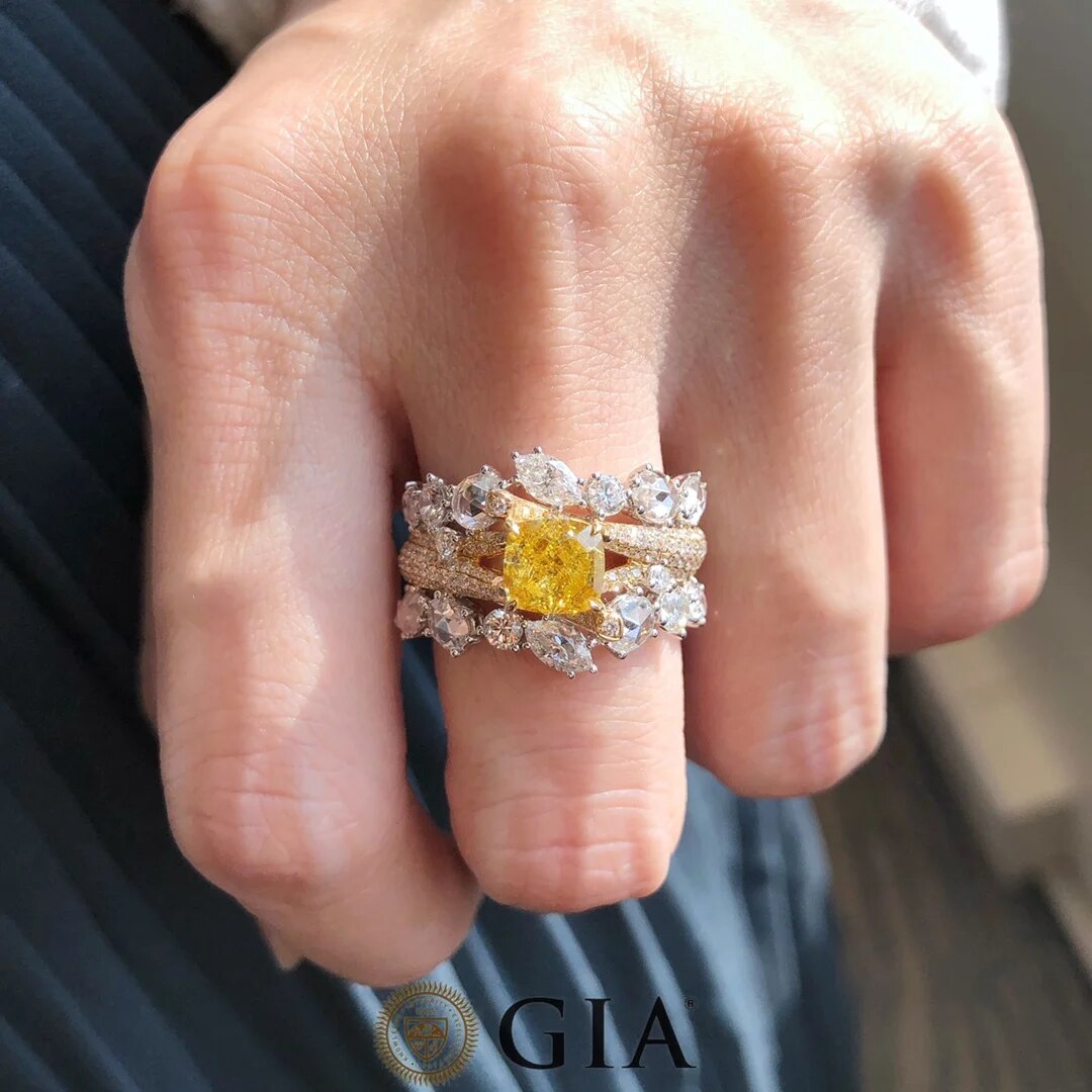 Close-up of Fancy Deep Yellow Diamond with White Diamond Accents in 18k Multi-Shape Ring