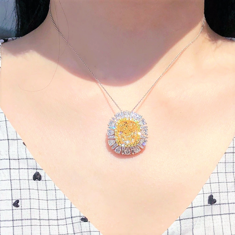 Convertible fancy yellow diamond pendant with 10ct GIA-certified center and white diamond accents.