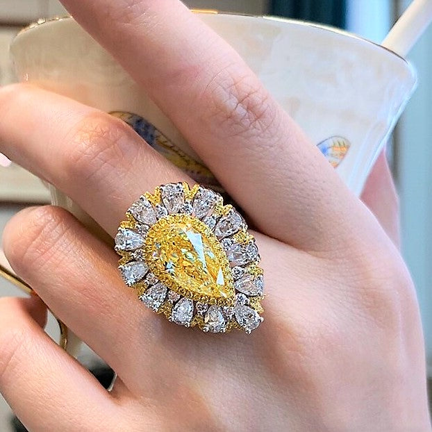 Convertible ring featuring 5.07ct GIA fancy light yellow diamond with 3.43ct white diamonds in 18K white and yellow gold.