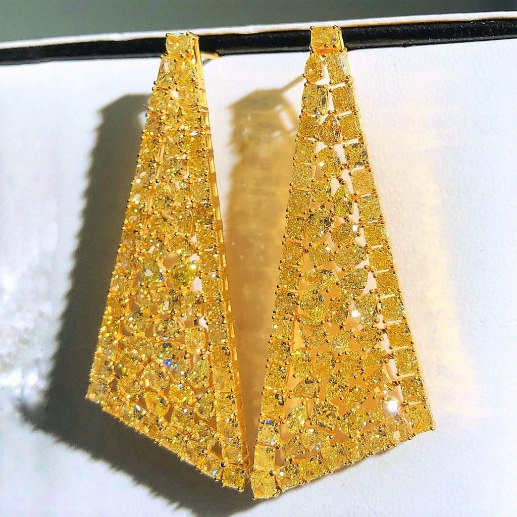 “Elegant fancy yellow diamond earrings from Eze Jewelry”