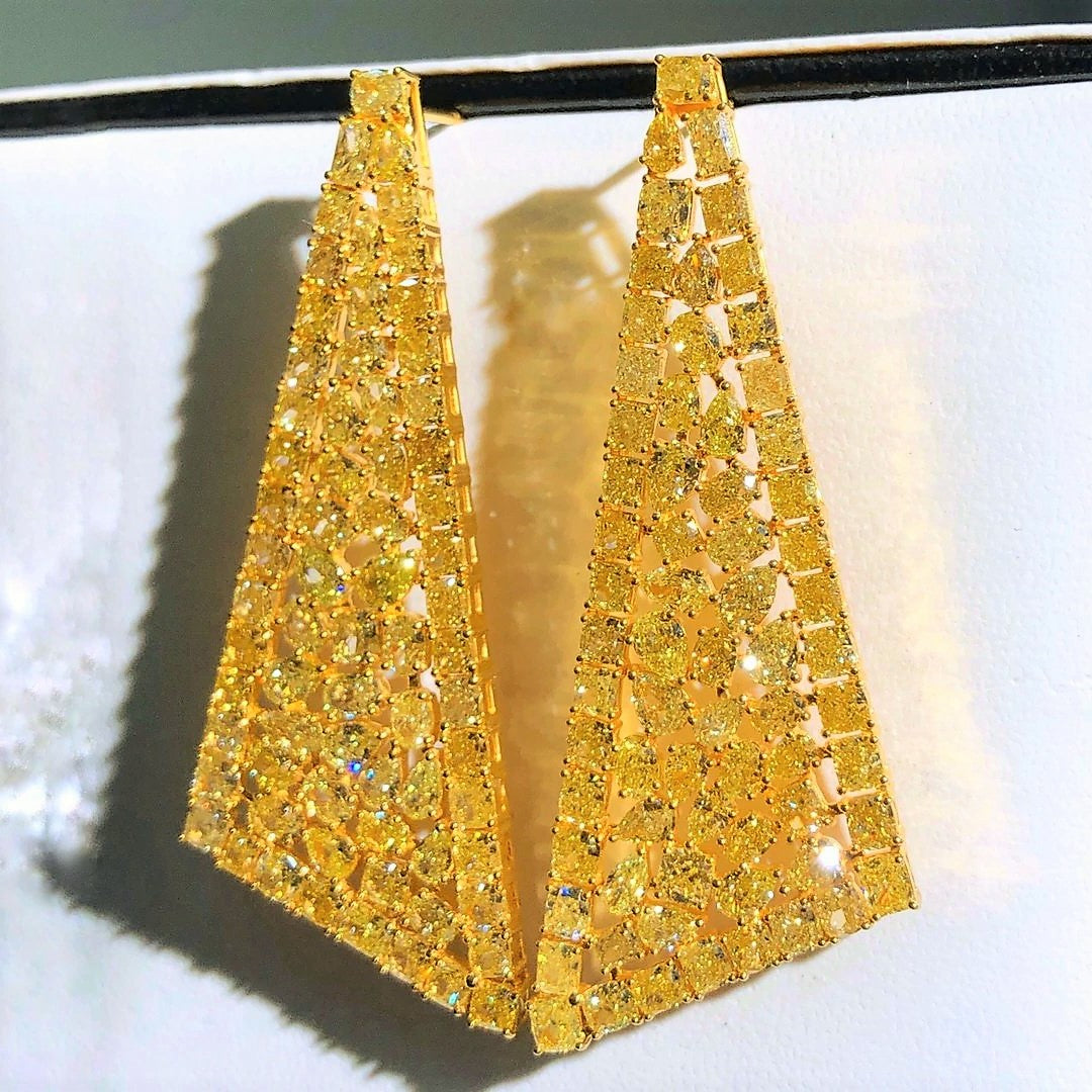 “Elegant fancy yellow diamond earrings from Eze Jewelry”