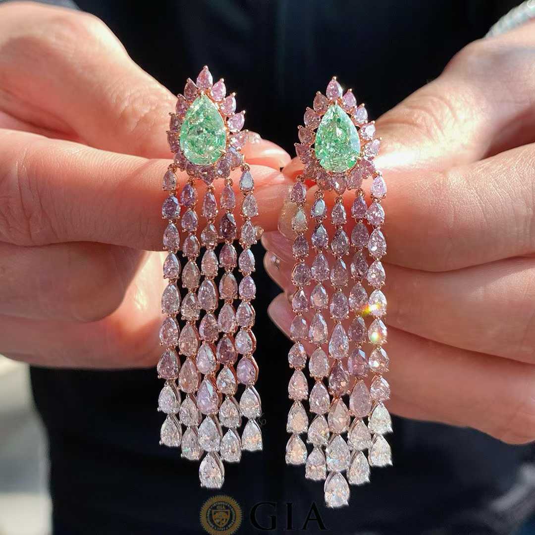 Elegant statement drop earrings featuring rare green diamonds and natural diamonds