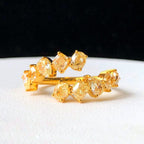 “Fancy yellow pear, oval, and square diamond ring by Eze Jewelry”