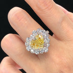  Heart shape fancy yellow diamond halo ring with white diamonds, 18K white gold, total weight 5.72 carats.