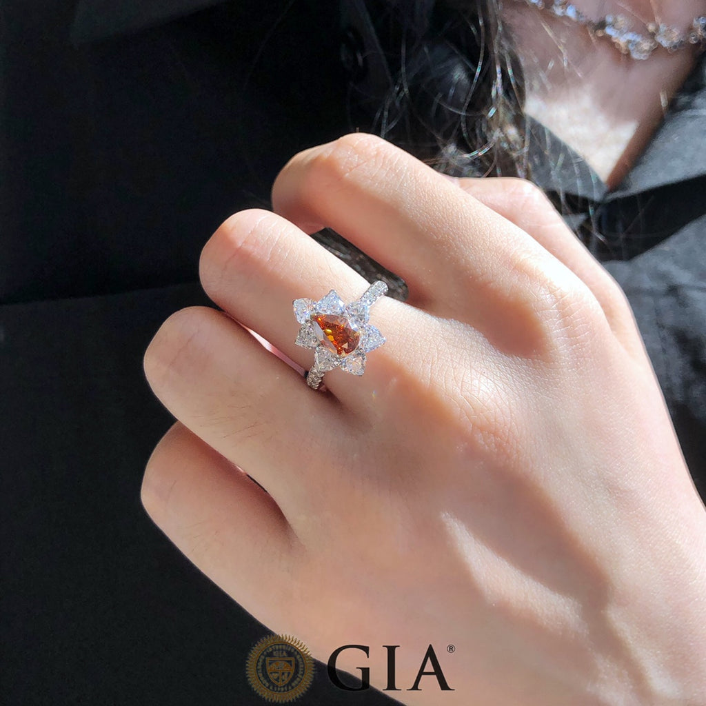 Pear-shaped 1ct GIA Fancy Deep Orange Brownish Diamond Ring with white diamonds in 18k white gold