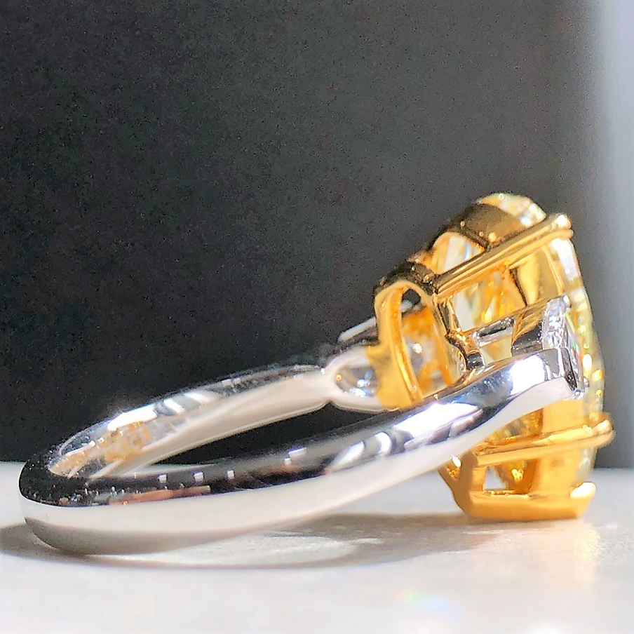  Side profile of 5ct yellow diamond engagement ring showing band and diamond setting.