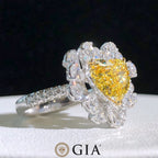  Side profile of yellow diamond halo engagement ring showcasing setting and diamond band.