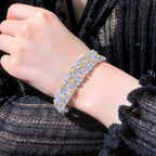 Side view of 16.80ct diamond bracelet with secure clasp and dual gold tones.