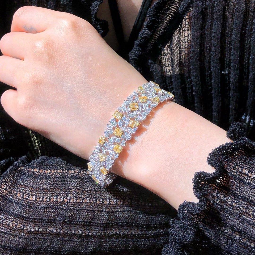  Side view of 16.80ct diamond bracelet with secure clasp and dual gold tones.